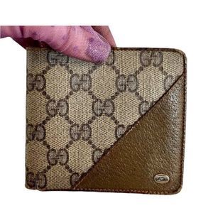 Beige Gucci multiple compartment wallet and coin pouch